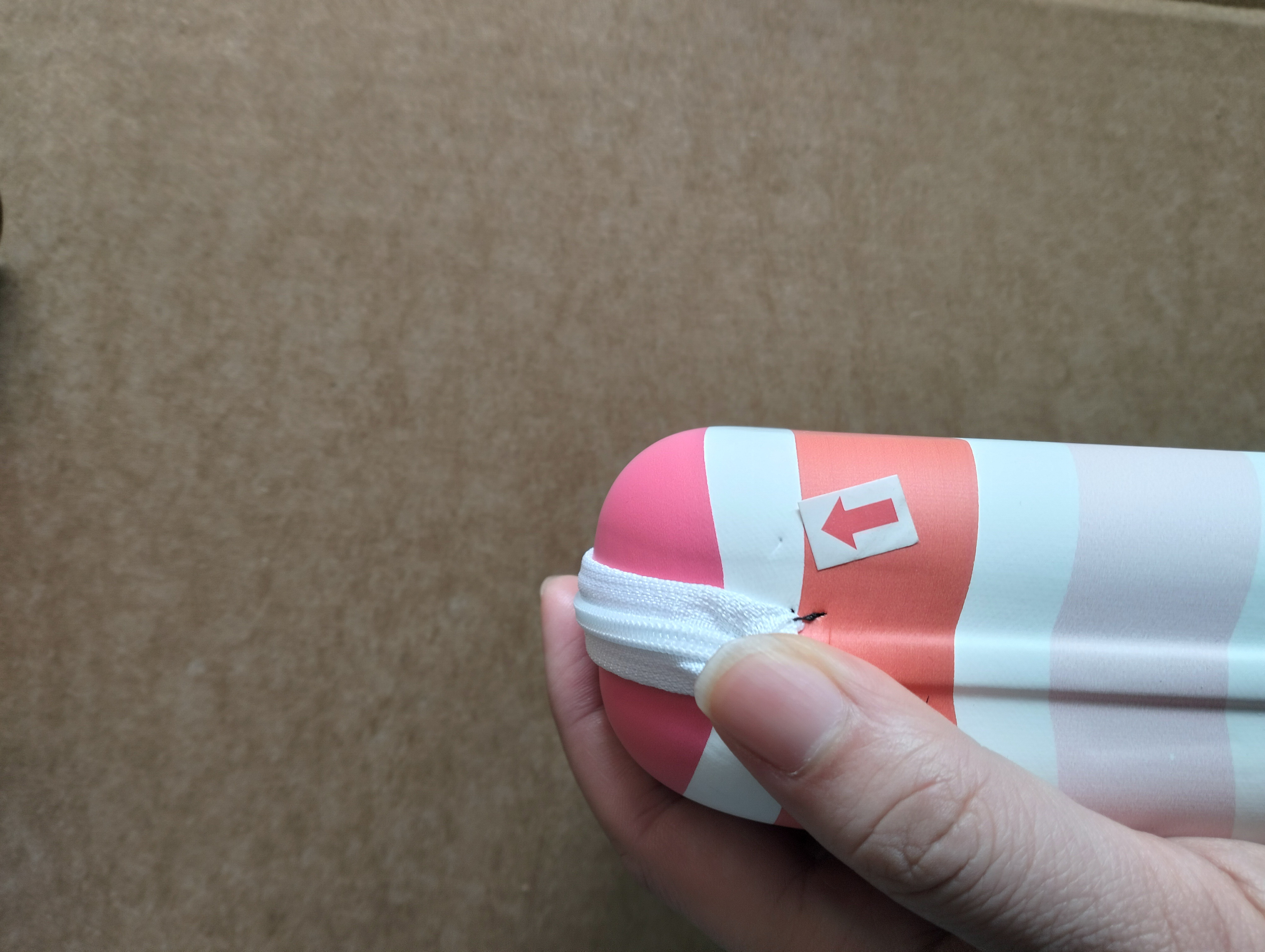 Defect photo with red arrow marking a fold