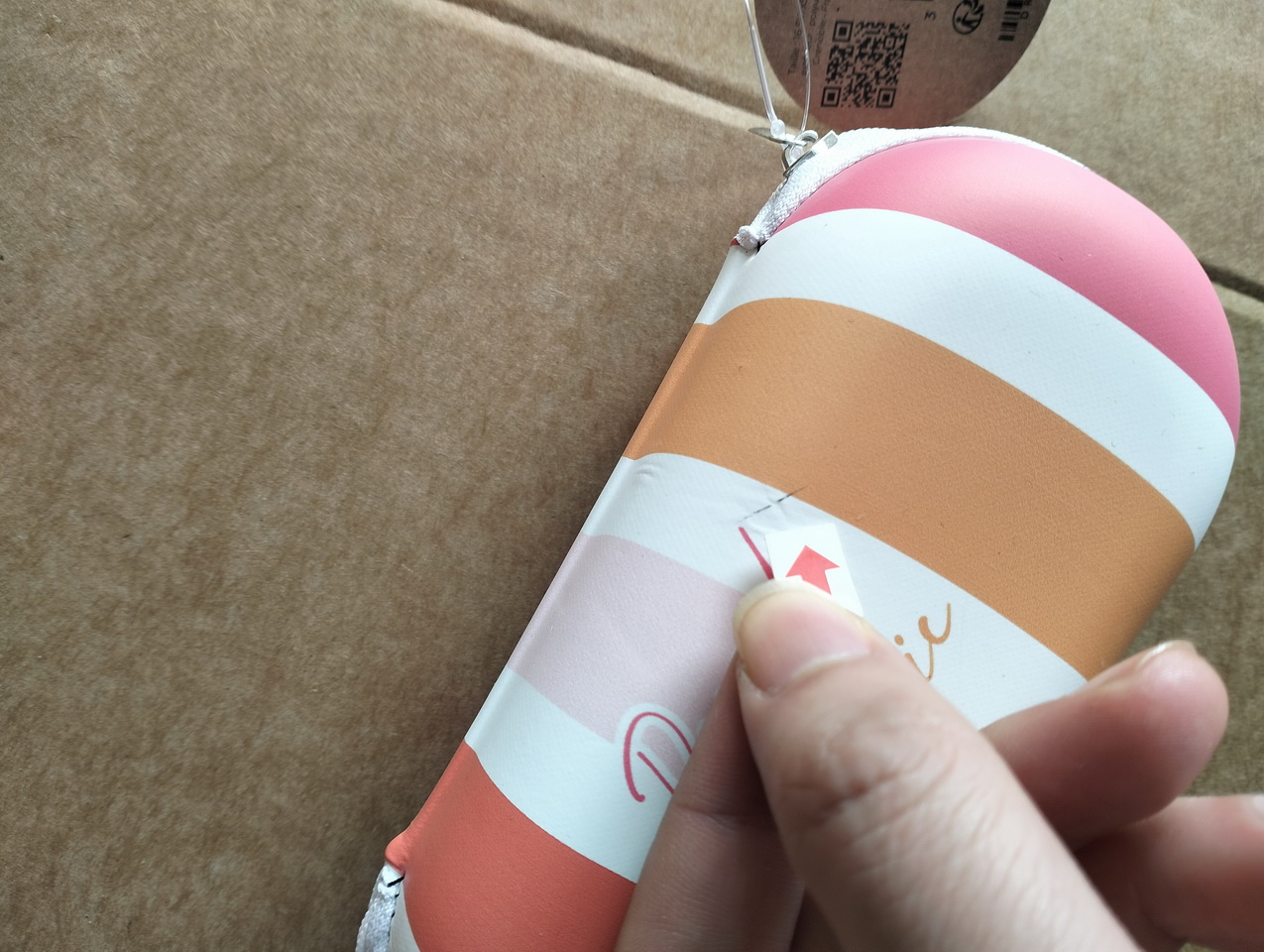Defect photo with red arrow marking a pinhole
